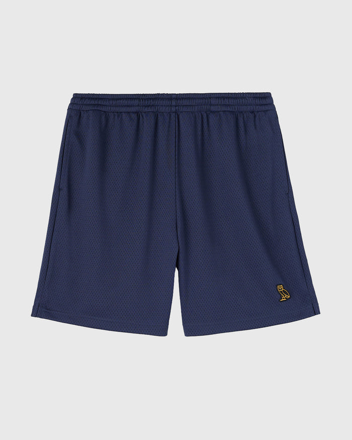 Navy mesh shorts with elasticated waistband and small gold embroidered logo on thigh.