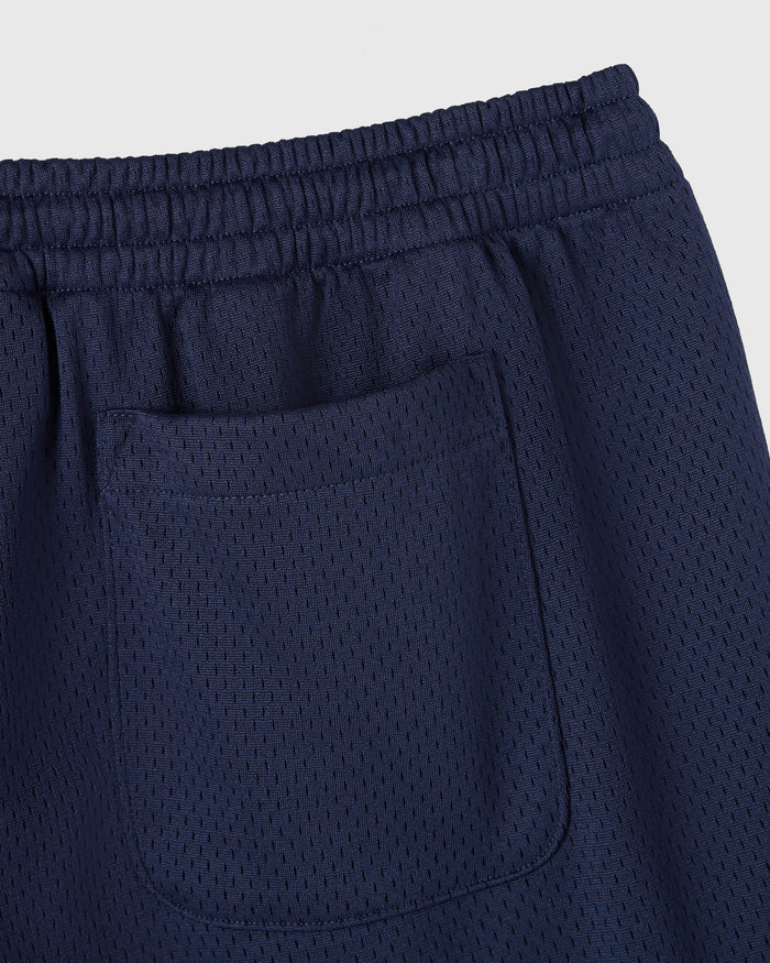 Navy mesh shorts with elasticated waistband and front pocket detail.
