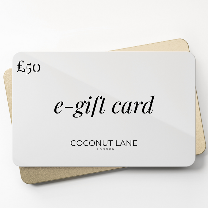 £50 Coconut Lane E-Gift Card with a white front, layered over a partially visible gold card.