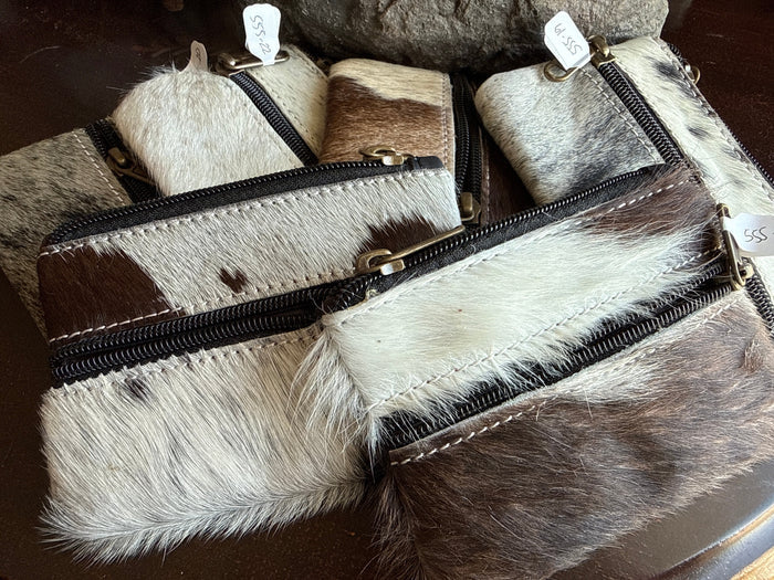 Small cowhide coin purse with double black zippers and brass pulls