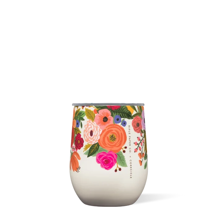 A cream-colored stemless cup with a floral pattern from Rifle Paper Co.