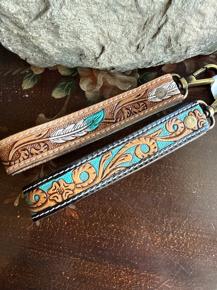 Cowhide wristlet keychain with turquoise feather design and brass clasp
