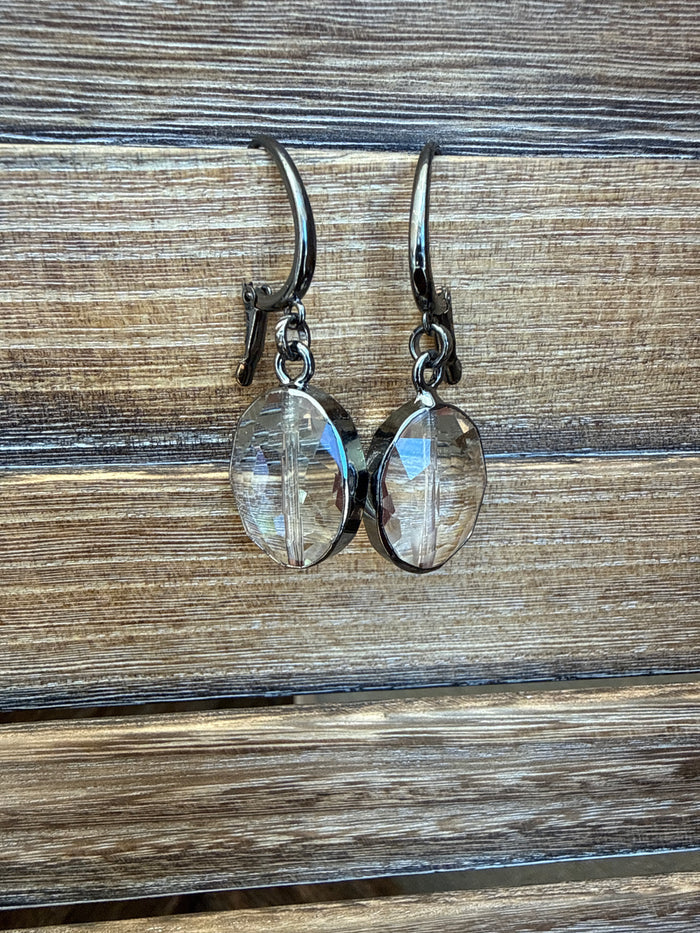 Faceted crystal oval pendant clasp earrings with blue shimmer, silver-tone hooks