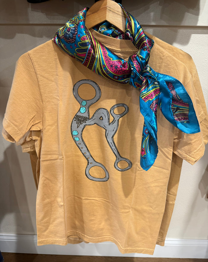 Mustard graphic t-shirt front with large cartoon animal print in gray and turquoise