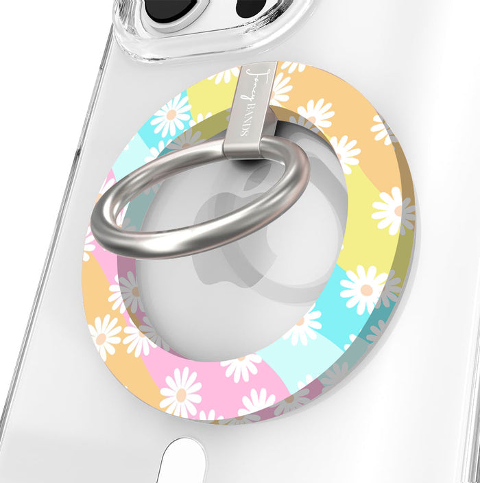 Daisy Dream MagSafe grip ring with pastel rainbow waves and white daisies on phone