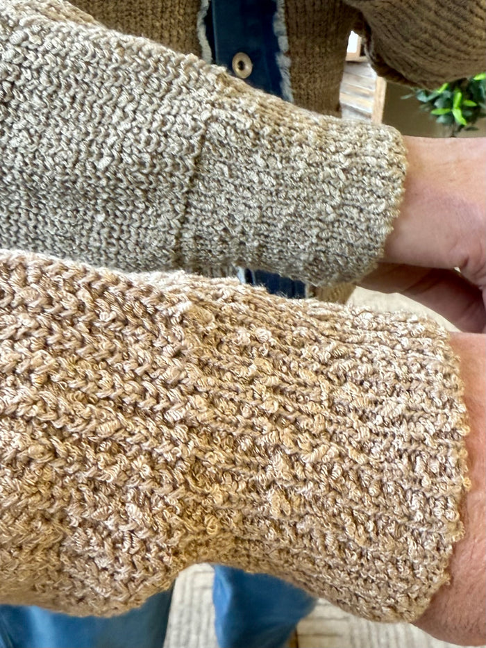 Beige textured knit cardigan sleeve with ribbed cuff
