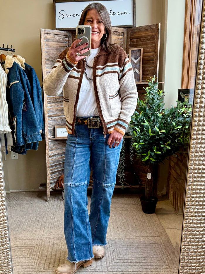 Tan cowboy cardigan with striped trim, button front, and horse-and-cactus knit