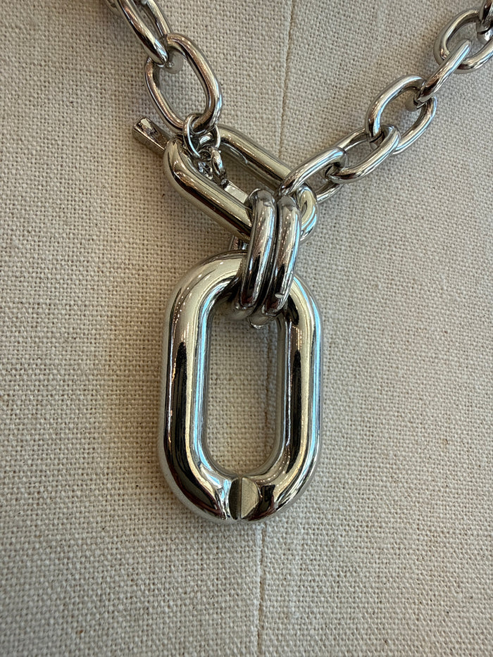 Silver chunky chain necklace with oversized oval link pendant detail