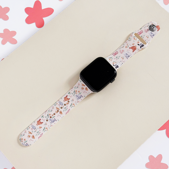 Apple Watch strap with colorful floral and animal print on soft silicone.