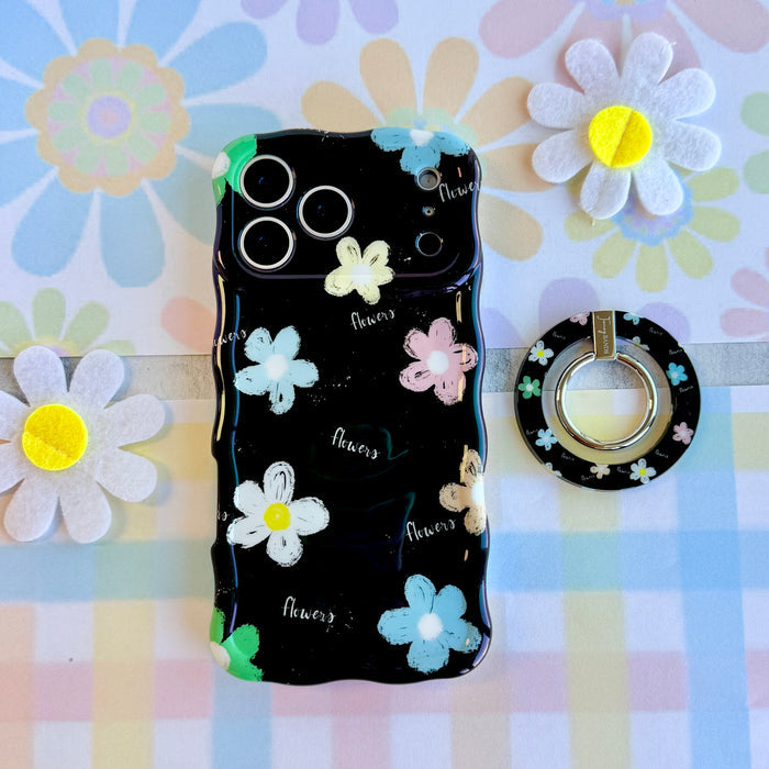 Flower Pop pattern MagSafe phone grip ring with sketched colorful flowers and script text on black background compatible with iPhone and Samsung