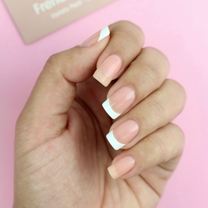 French Mani Strips classic white French tips on a sheer nude manicure