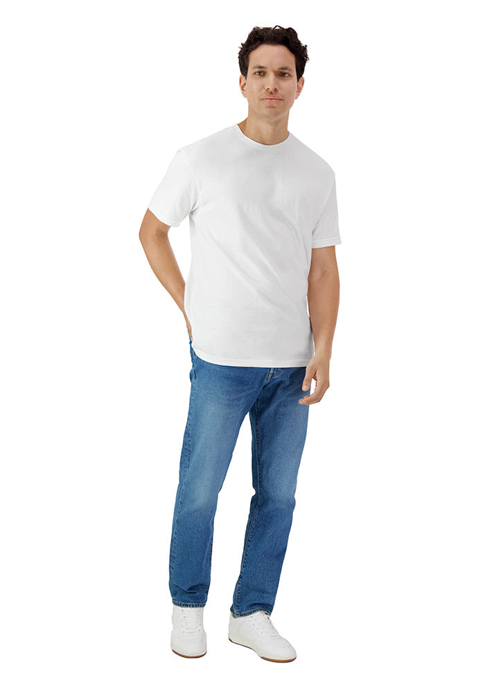 Man wearing a relaxed fit plain white short sleeved t-shirt and blue jeans on a white background
