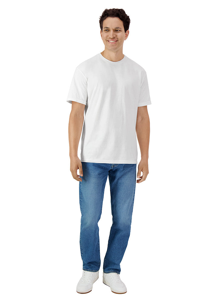 Man wearing a relaxed fit plain white short sleeved t-shirt and blue jeans on a white background