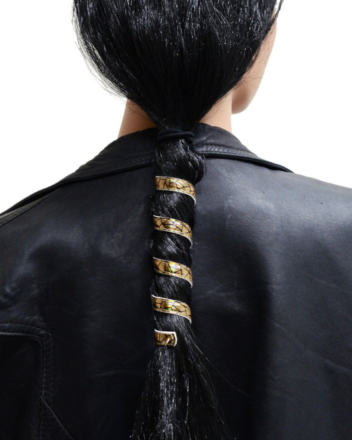 6-inch gold holographic leather ponytail holder wrapped around a long ponytail, spiral leather hair accessory worn by model and shown from the back.
