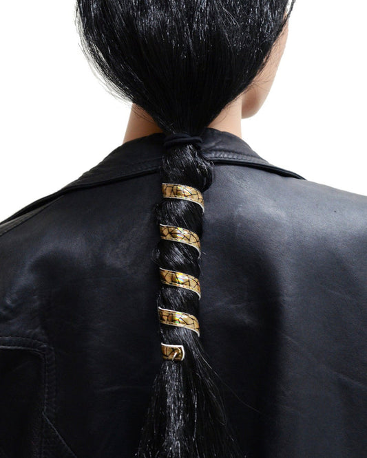 6-inch gold holographic leather ponytail holder wrapped around a long ponytail, spiral leather hair accessory worn by model and shown from the back.
