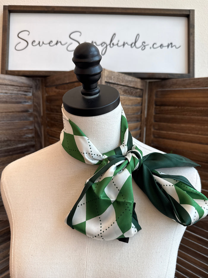 Green and white argyle twilly scarf tied in a bow on a mannequin neck