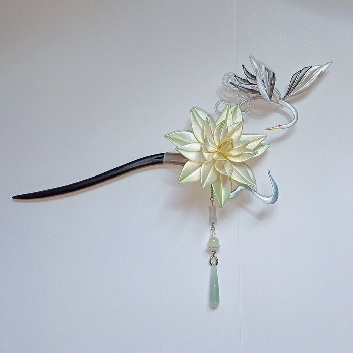 Handcrafted Chanhua thread-wrapped hairpin featuring a multi-layered cream flower, a silver and white crane in flight, and a hanging green teardrop bead.