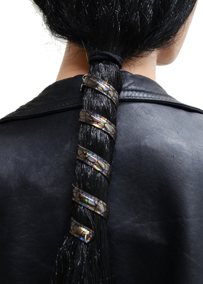 Model wearing 12 inch holographic black faux leather ponytail wrap, spiral design, back view in ponytail