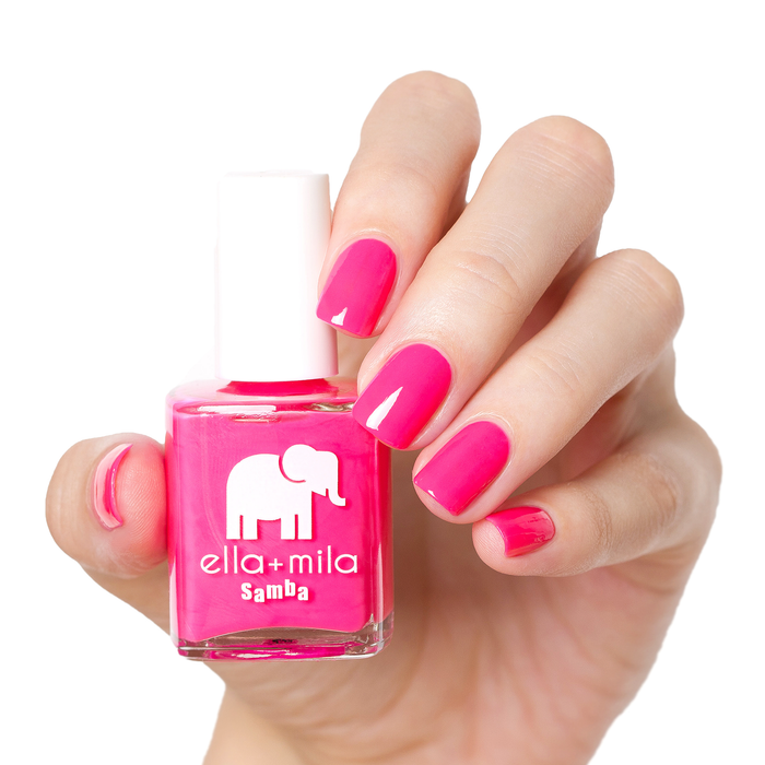 I Pink I Love You bright pink nail polish manicure on a light skin tone with the bottle