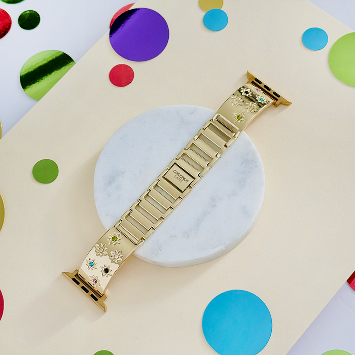 Gold Apple Watch strap with colourful stone flower charms by Coconut Lane.
