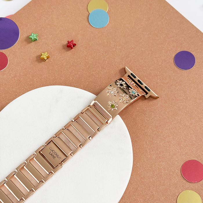 Rose gold Apple Watch strap with colourful stone beads and floral charms.