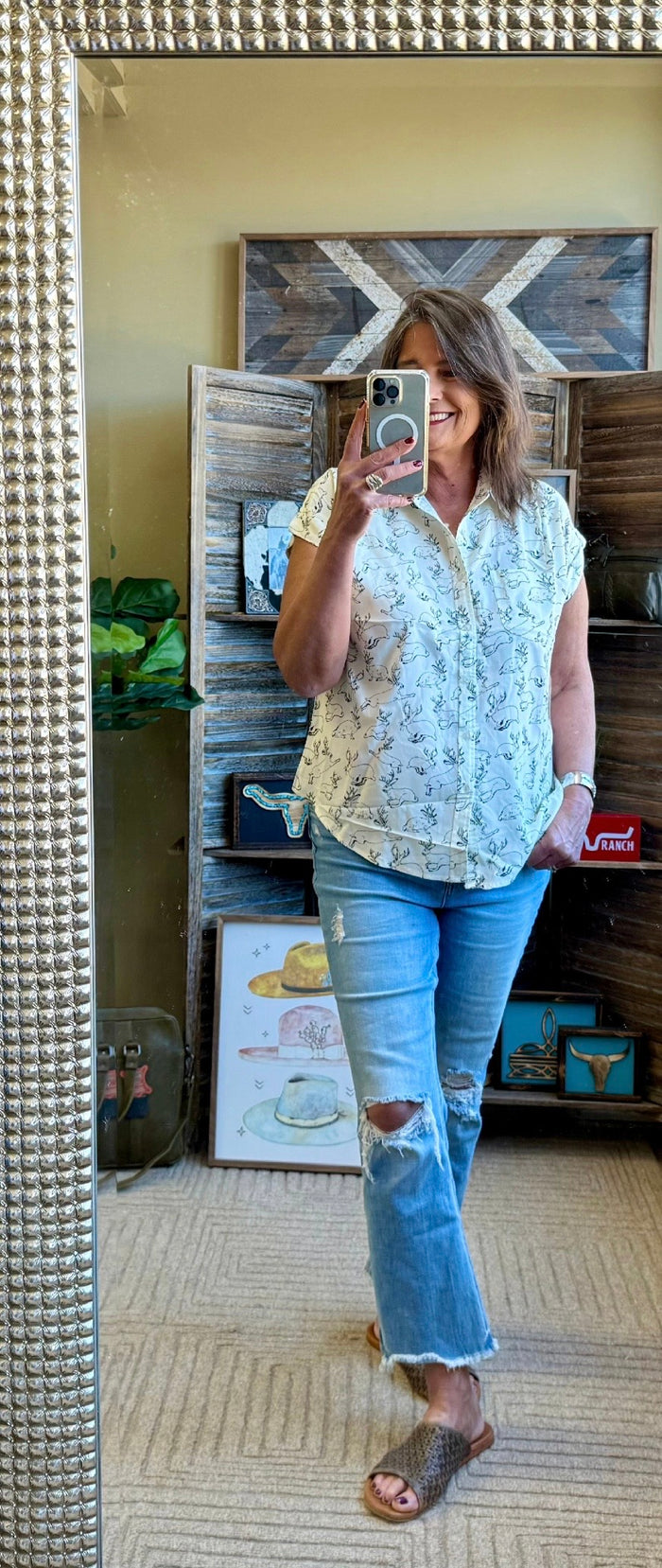 Light blue short-sleeve camp shirt with jackalope print and front buttons