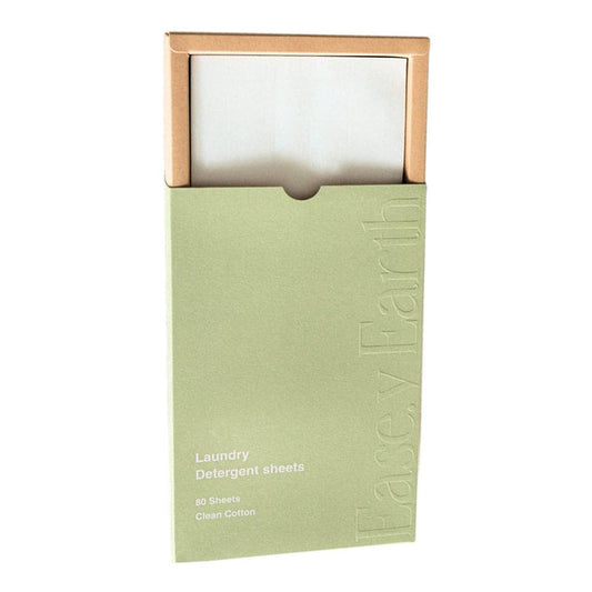 Green package of laundry detergent sheets in a cardboard box with sleeve. Plastic free. Clean cotton fragrance.
