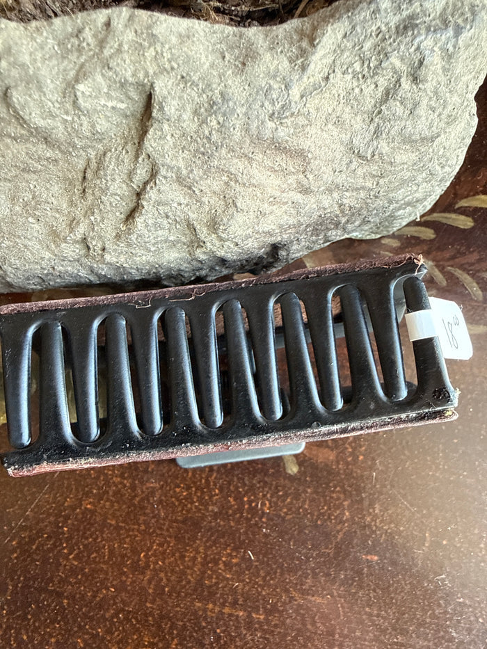 Dark brown leather hair claw with arched metal comb and top fastening plate