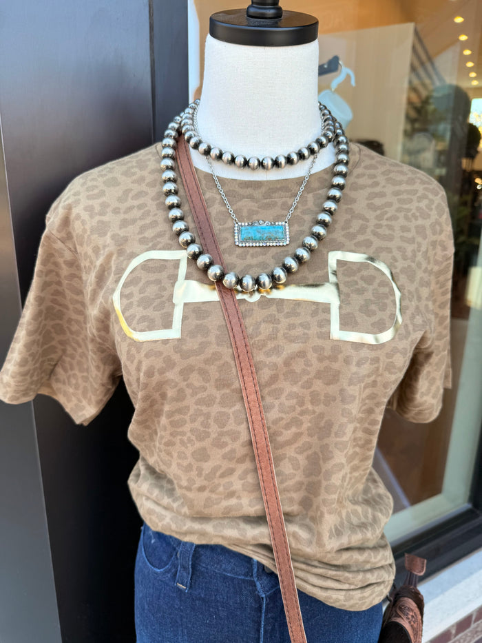 Leopard-print graphic T-shirt with white outlined bit motif and small blue center