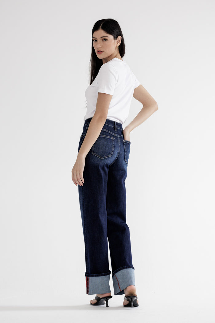Dark wash wide-leg cuffed denim jeans with button fly and belt loops
