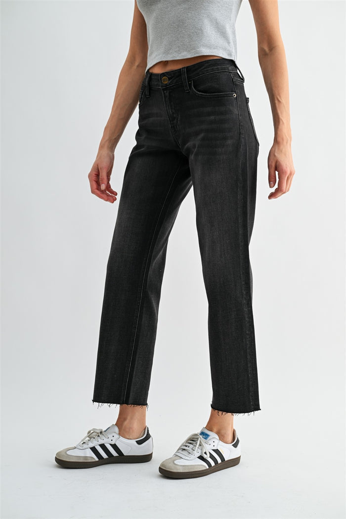 Mid-rise black straight ankle jeans, front view with zipper fly, belt loops and frayed hem