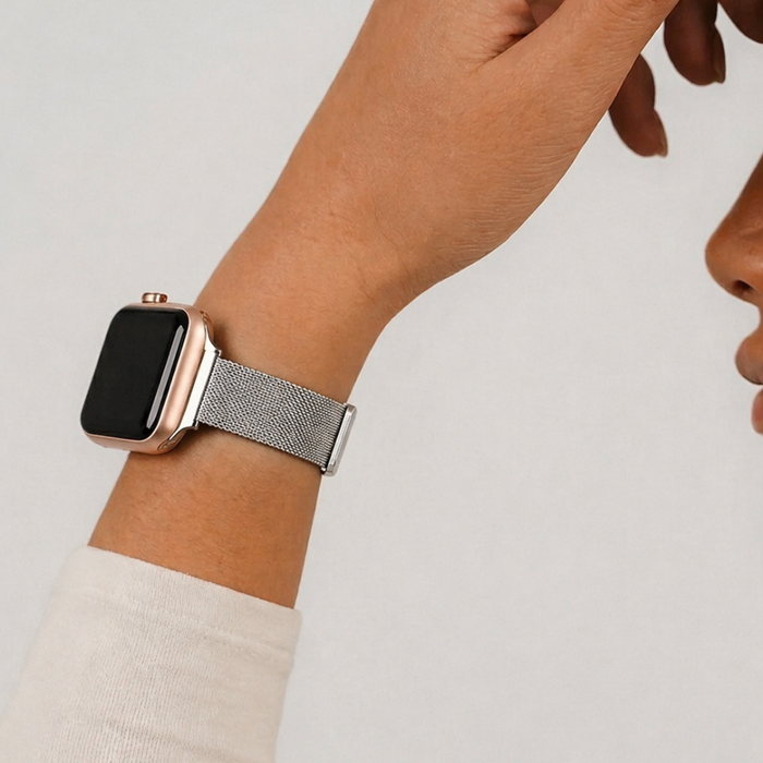 Studio close up image of the silver milanese watch strap
