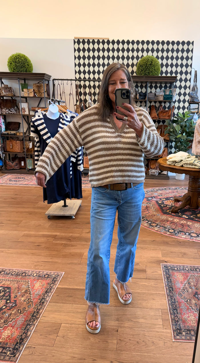 Mocha-and-cream striped loose knit sweater with raw hem and cuffs, long sleeves