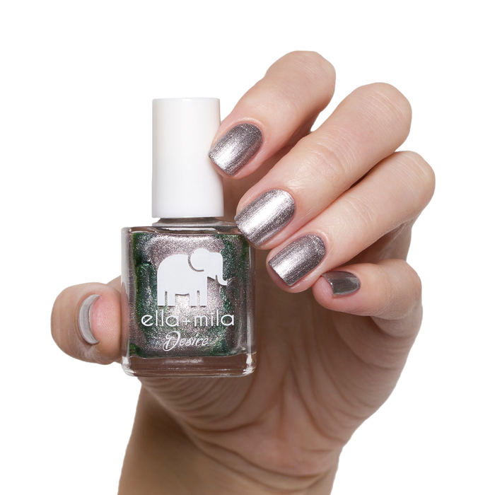 Moonshadow metallic silver nail polish manicure on a light skin tone with the bottle