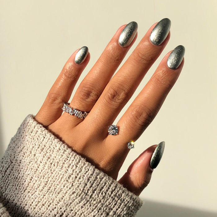 Moonshadow metallic silver nail polish manicure on a medium skin tone in sunlight