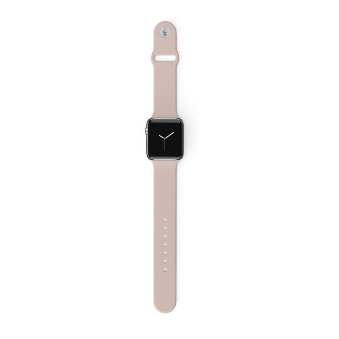 Powder pink NAKD Apple Watch strap by Coconut Lane on a smartwatch with black screen, lying flat on a white surface.