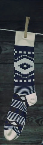 Navy and white Aztec-pattern crew socks with geometric motifs and striped sections
