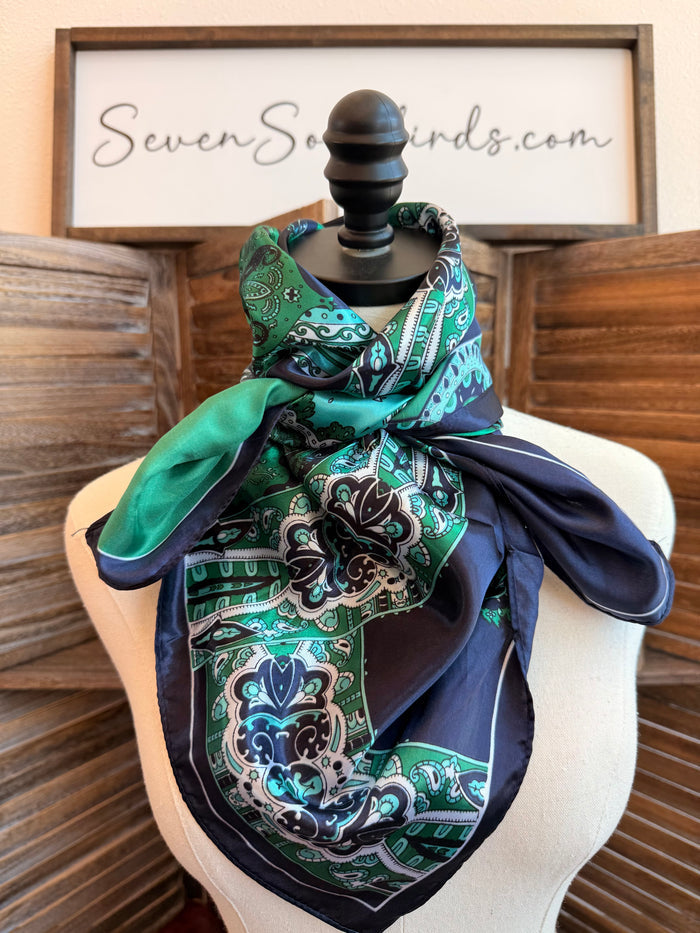 Navy and emerald wild rag scarf on mannequin, paisley print with border