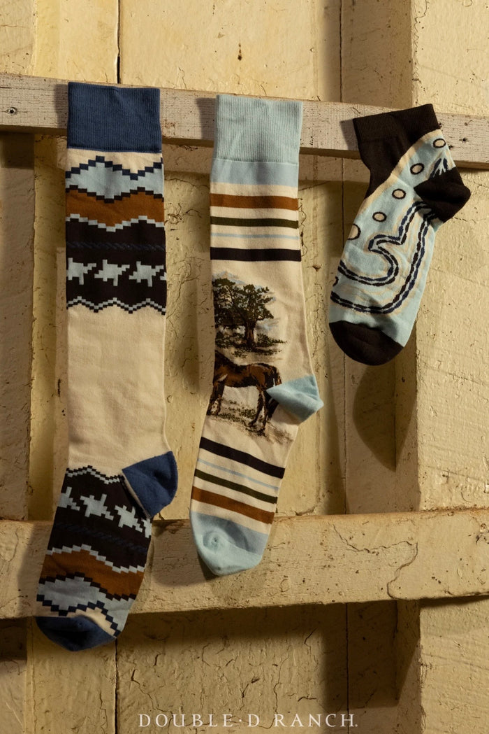 Socks trio bundle with zigzag, striped, and graphic designs in dark blue and light tones