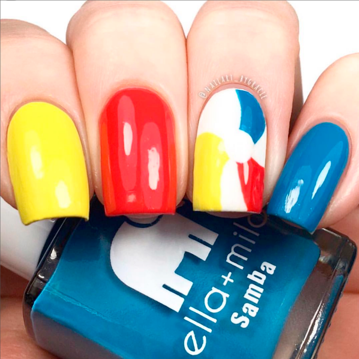 Ocean Air blue nail polish with yellow and red color-block nail art