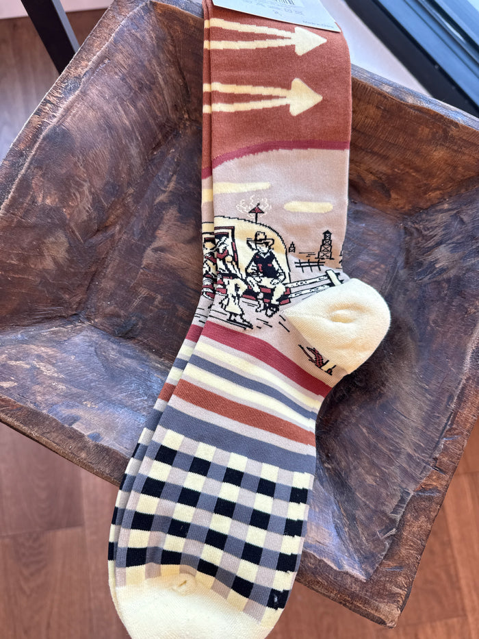 Double D Ranch oil camp socks with cowboy illustration, red arrow bands, black checkered toe