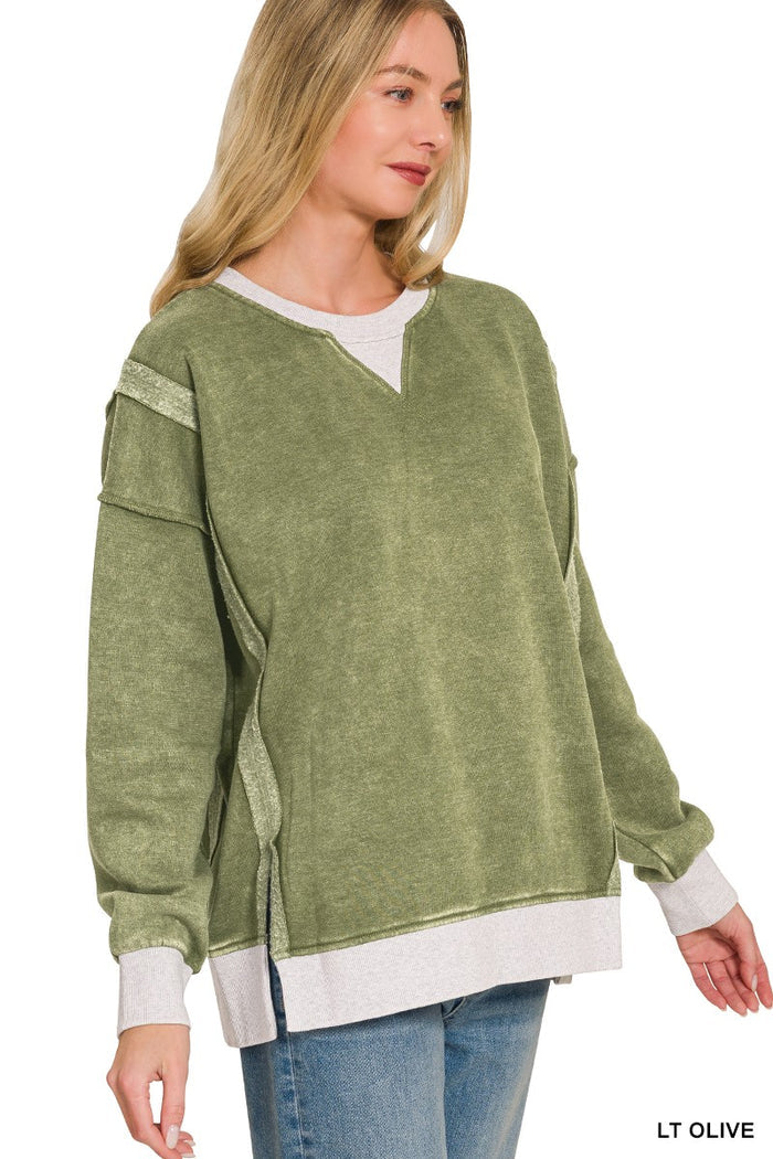 Olive washed sweatshirt with contrasting white V-neck trim and long sleeves