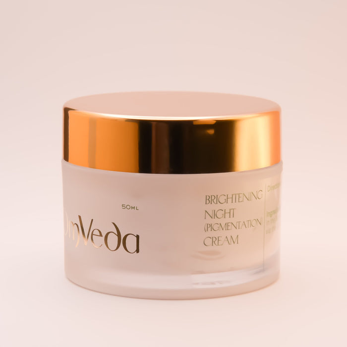 OmVeda brightening night cream jar close-up, gold lid and front label