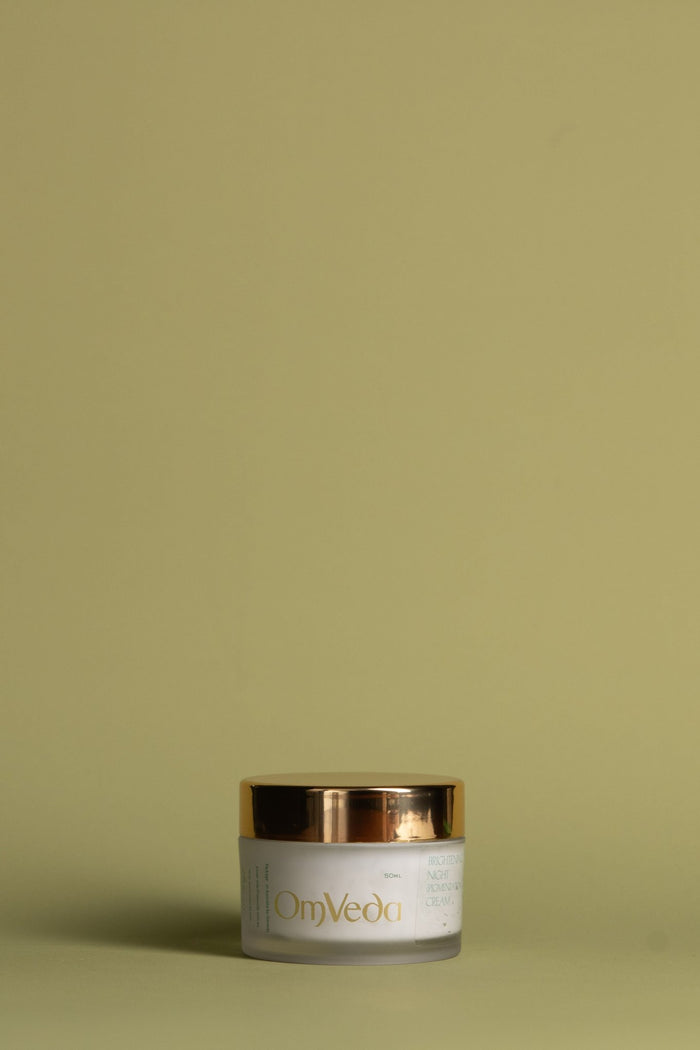 OmVeda brightening night cream jar with gold lid, on display