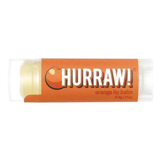 Tube of orange organic lip balm.
