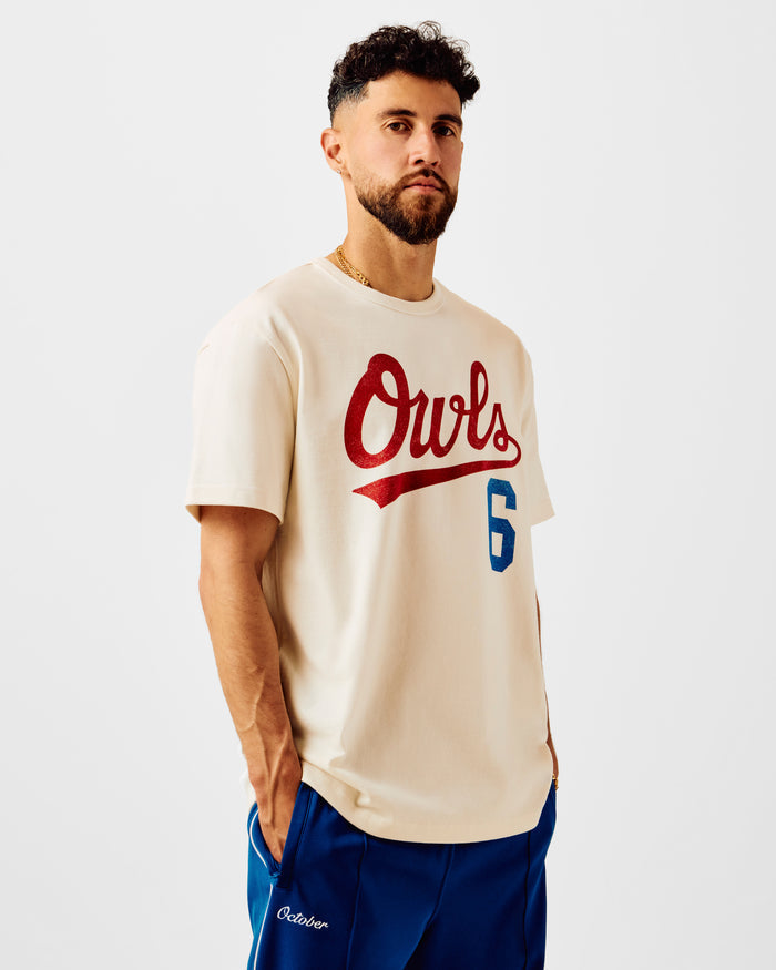 Cream t-shirt with red "Owls" script text and blue number 5 on chest.
