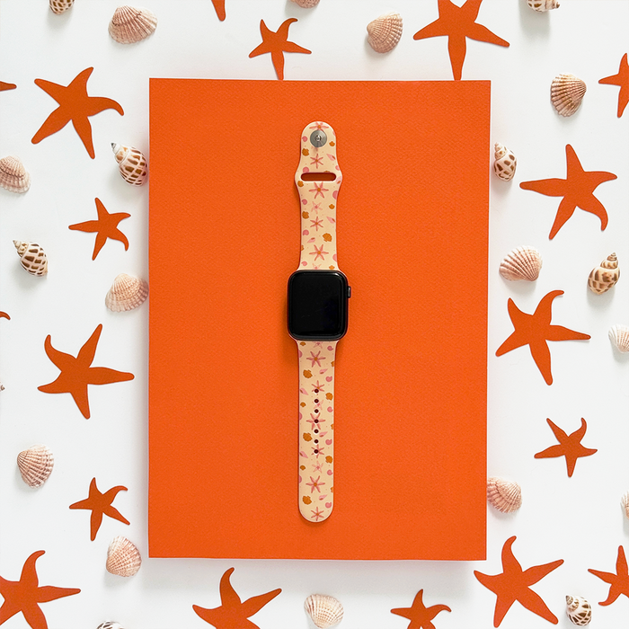 Orange Apple Watch strap with starfish and seashell cutouts, Coconut Lane Peachy Beach design.