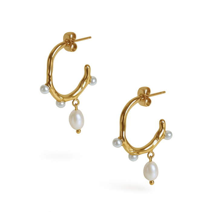 Pearl Waltz Earrings with dangling white pearls on polished stainless steel by Coconut Lane.