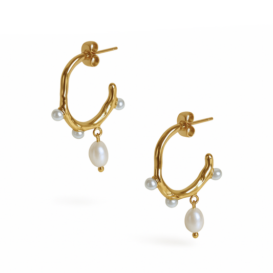 Pearl Waltz Earrings with dangling white pearls on polished stainless steel by Coconut Lane.