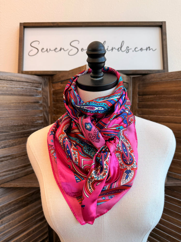 Pink paisley wild rag scarf on mannequin with long flowing tails
